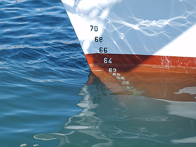 white and red boat at water level 63 thumbnail