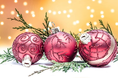 three red Christmas baubles thumbnail