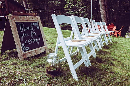 Empty White Wooden Folding Chairs thumbnail