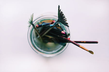selective-focus photography of paint brushes on glass thumbnail