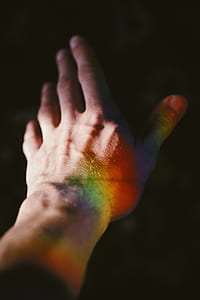 close up photo of left human hand with dark background thumbnail