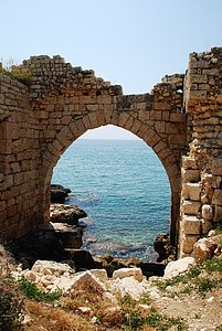 arch-shape bricks gate near seashore thumbnail
