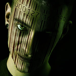 portrait photography of man with barcode face tattoo thumbnail