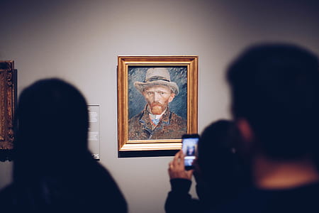 people takes photo of man painting inside room thumbnail