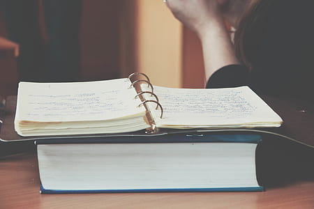 open notepad on top of book thumbnail