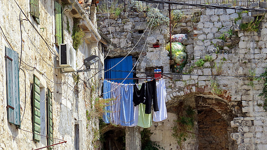 clothes hanging near wall thumbnail