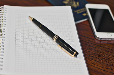 black and brown twist pen on notebook thumbnail