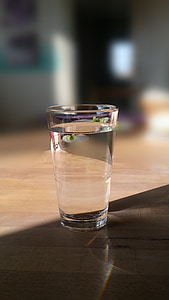 glass cup on brown surface thumbnail