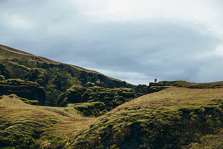 A couple on a hiking adventure on top of a hill thumbnail
