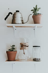 gray kettle beside brown pot on float rack thumbnail