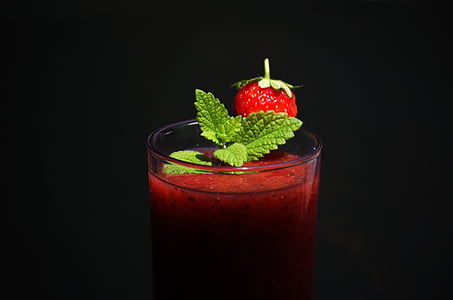 red liquid filled clear drinking glass with strawberry thumbnail
