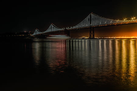 high bridge with lights during nighttime thumbnail