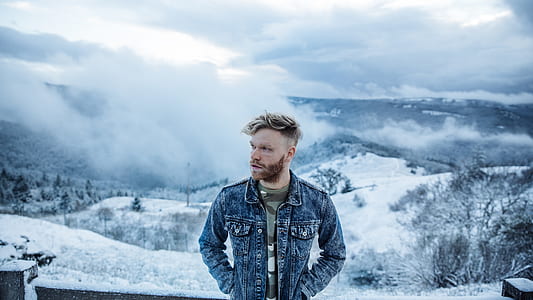 landscape photo of man wearing blue denim jacket thumbnail