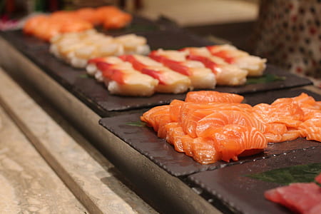 raw fish meat on black platter thumbnail