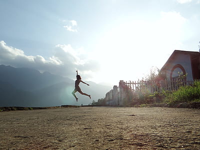 person jumping near house thumbnail