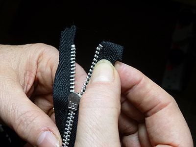 person holding zipper thumbnail