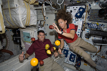 photo of astronauts inside space station thumbnail