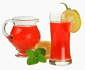 apple juice in glass with slice of lemon thumbnail