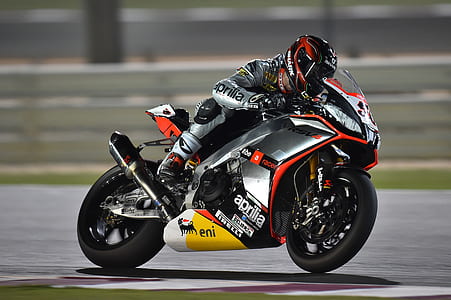 person riding on his gray sports bike thumbnail