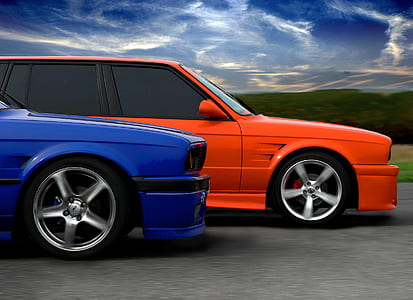 orange and blue cars on street thumbnail