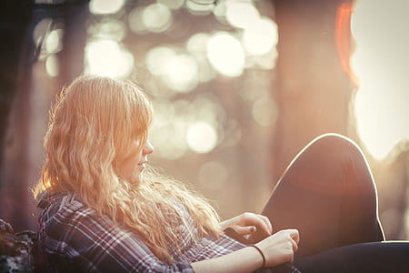 woman wearing gray-and-brown plaid sport shirt and black jeans thumbnail