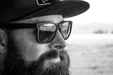 grayscale photography of man wearing sunglasses thumbnail
