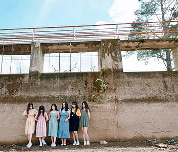 Group of Women Standing Infront of Wall thumbnail