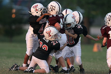 group of children playing football thumbnail