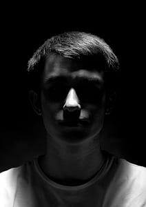 grayscale photo of man wearing crew-neck shirt thumbnail
