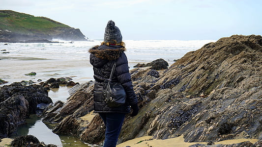woman standing beside body of water thumbnail