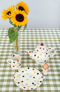 teapot beside of mug and sunflowers thumbnail