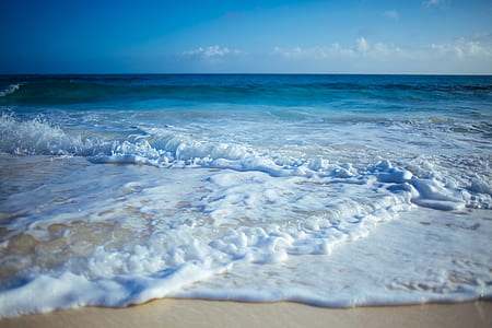 photo of seawaves on seashore during daytime thumbnail