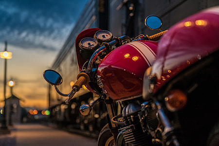 selective focus photography of red motorcycle thumbnail