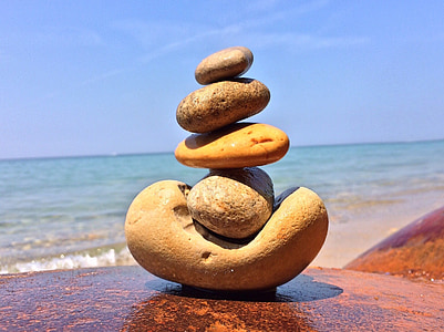 shallow focus photography stone balancing art during daytime thumbnail