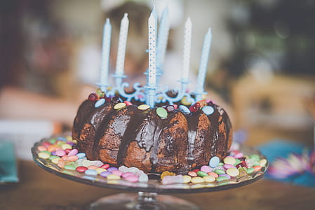 chocolate coated cake with candles thumbnail
