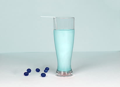 Glass of Milk Against White Background thumbnail