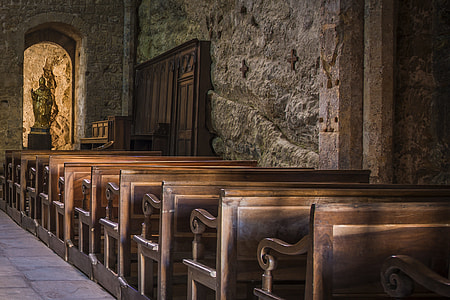 empty brown wooden pews in church thumbnail