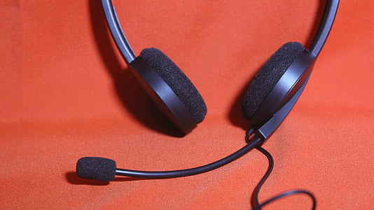 black corded headset on red surface thumbnail
