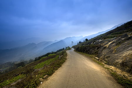 landscape photo of empty road at mountain valley thumbnail