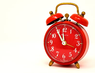 photo of red twin-bell alarm clock at 11:55 thumbnail