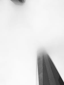 black building covered with fog thumbnail
