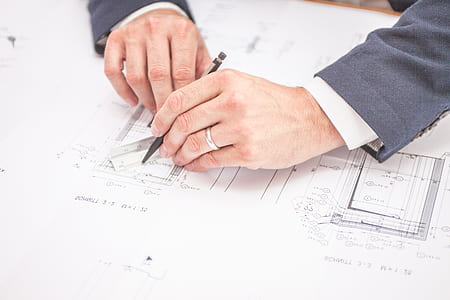 man holding pen on white printer paper thumbnail