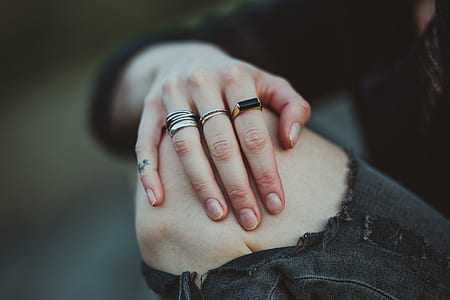 person showing several assorted rings thumbnail