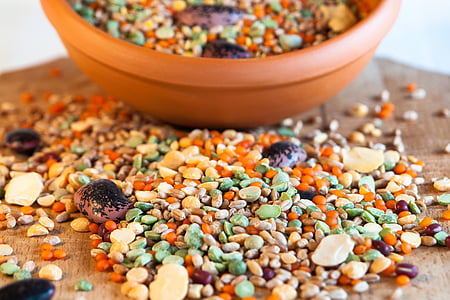 beige and green pebbles on brown wooden table thumbnail