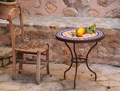 orange fruits on round brown patio table thumbnail