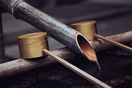 gray bamboo faucet in between bamboo dippers thumbnail