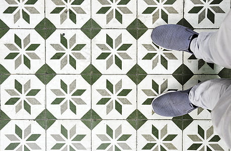 person standing on green and white flooring thumbnail
