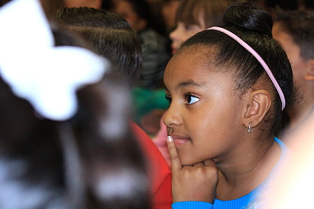 close-up photography of girl wearing blue crew-neck shrit thumbnail