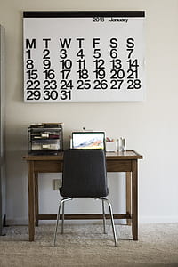 black leather chair near table thumbnail