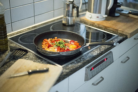 cooking pan on induction with sliced vegetables thumbnail